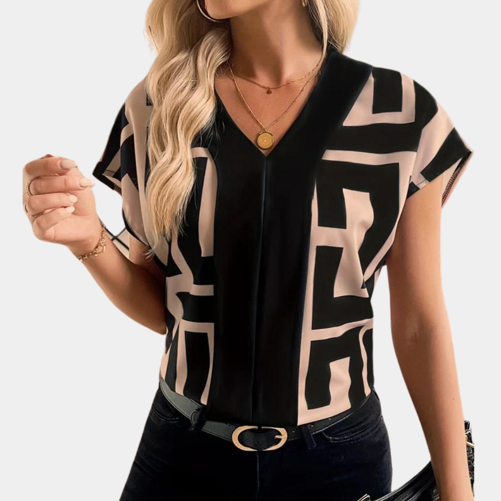 https://cdn.shopify.com/s/files/1/0830/7487/5738/files/Aria___Geometric_Graphic_Print_V-Neck_Blouse_0.png?v=1778598156