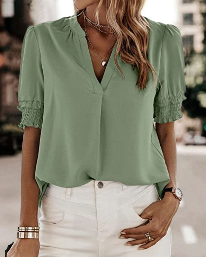 https://cdn.shopify.com/s/files/1/0830/7487/5738/files/Aria___Premium_Smocked_Cuff_V-Neck_Blouse_4.jpg?v=1778598152