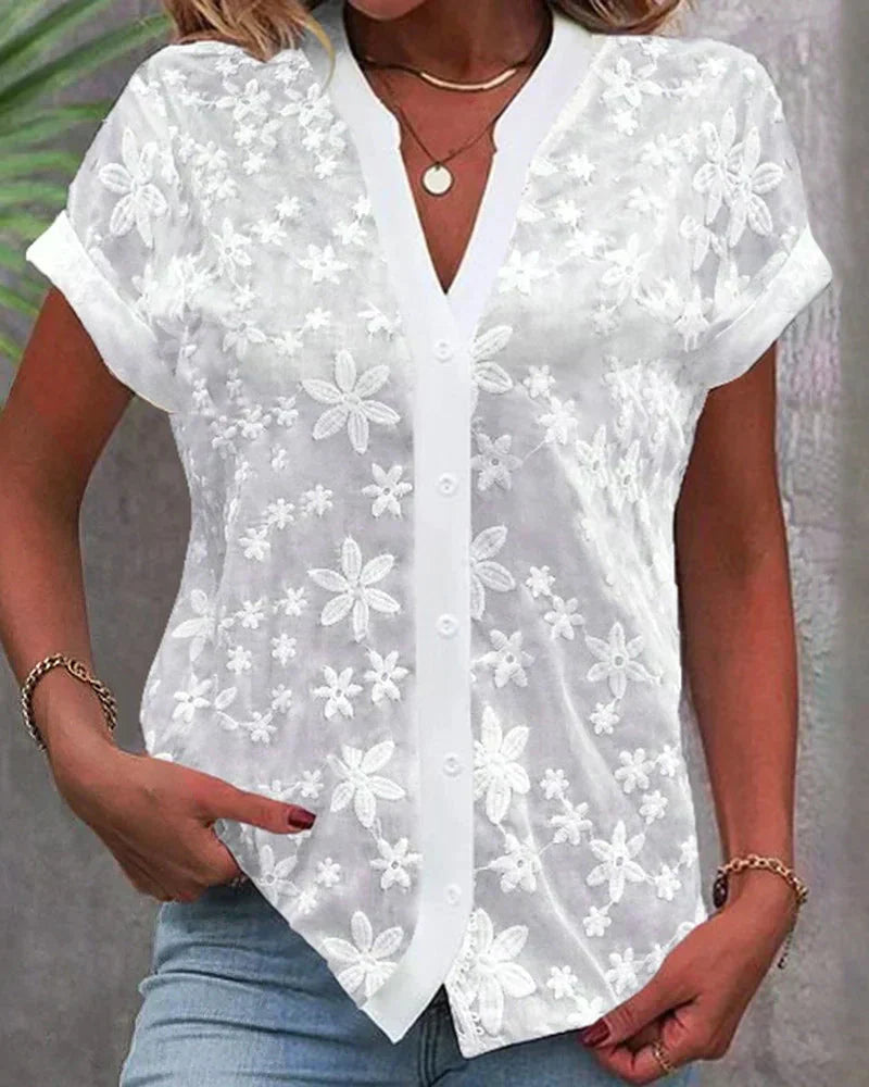 https://cdn.shopify.com/s/files/1/0830/7487/5738/files/Carolyn___Elegant_Floral_Lace_Button-Front_Blouse_0.jpg?v=1778598146