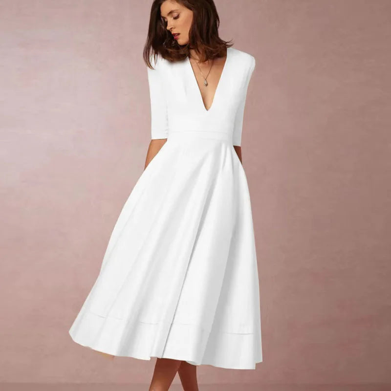 https://cdn.shopify.com/s/files/1/0830/7487/5738/files/Elara___White_Midi_Dress__Retro-Inspired__Elegant__amp__Flattering_A-Line_6.jpg?v=1778597130