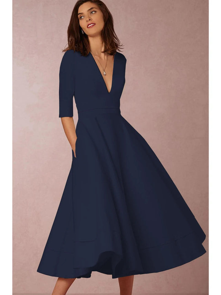 https://cdn.shopify.com/s/files/1/0830/7487/5738/files/Elara___White_Midi_Dress__Retro-Inspired__Elegant__amp__Flattering_A-Line_9.jpg?v=1778597129