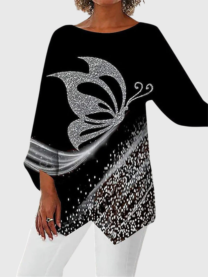 https://cdn.shopify.com/s/files/1/0830/7487/5738/files/Eleanor___Elegant_butterfly_print_top_with_asymmetric_hem_0.jpg?v=1778598149