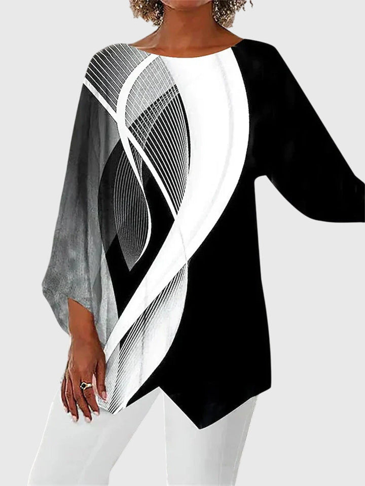 https://cdn.shopify.com/s/files/1/0830/7487/5738/files/Eleanor___Elegant_butterfly_print_top_with_asymmetric_hem_3.jpg?v=1778598148