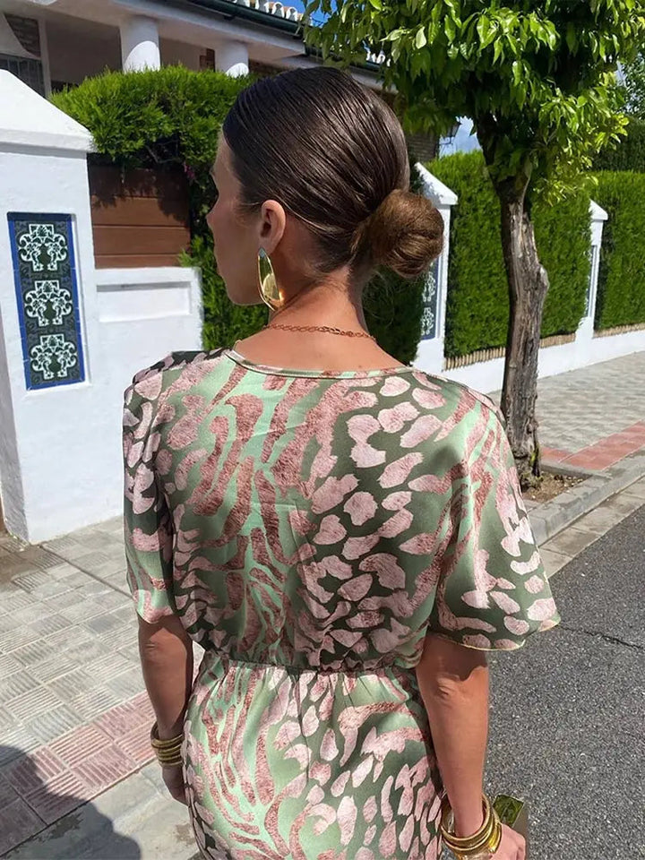https://cdn.shopify.com/s/files/1/0830/7487/5738/files/LunaBelle___Elegant_Twisted_Knot_Women_s_Dress_for_Wedding_Guests_4.jpg?v=1778597038