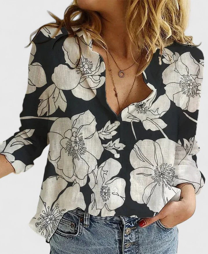 https://cdn.shopify.com/s/files/1/0830/7487/5738/files/Mary___Floral_V-neck_long-sleeve_blouse_1.jpg?v=1778598149