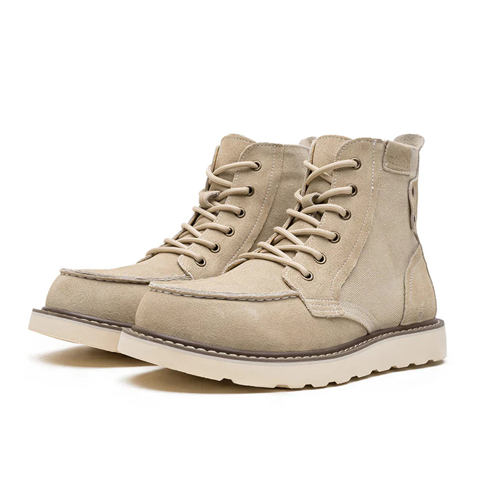 https://cdn.shopify.com/s/files/1/0830/7487/5738/files/Men_s6Moc-ToeWedgeBoots-HeritageSuedeC003_11.webp?v=1773580965