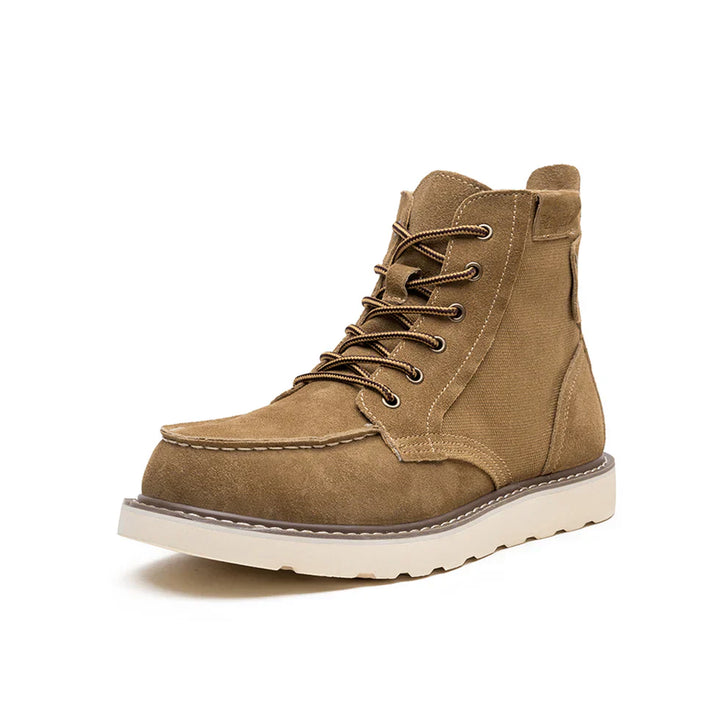 https://cdn.shopify.com/s/files/1/0830/7487/5738/files/Men_s6Moc-ToeWedgeBoots-HeritageSuedeC003_2.webp?v=1773580965