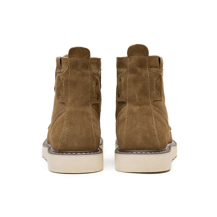 https://cdn.shopify.com/s/files/1/0830/7487/5738/files/Men_s6Moc-ToeWedgeBoots-HeritageSuedeC003_3.webp?v=1773580965