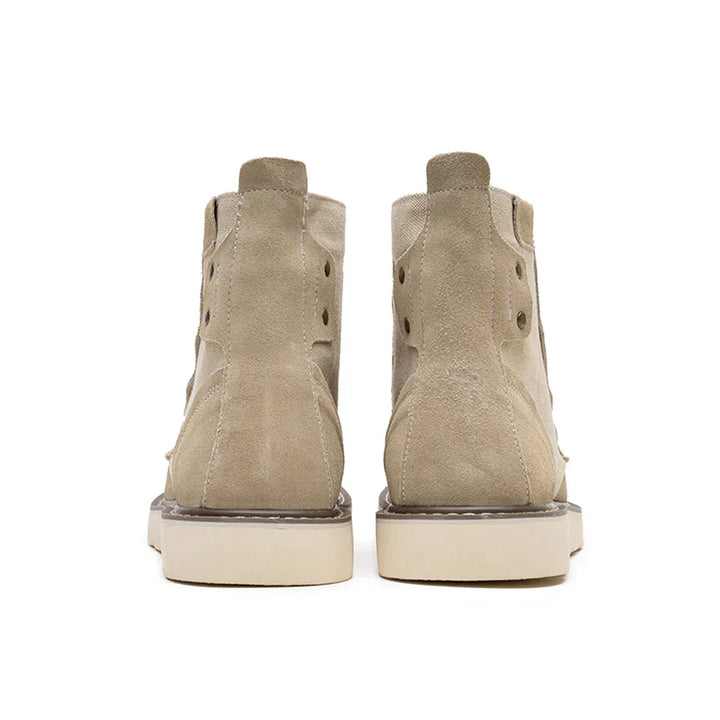https://cdn.shopify.com/s/files/1/0830/7487/5738/files/Men_s6Moc-ToeWedgeBoots-HeritageSuedeC003_9.webp?v=1773580964