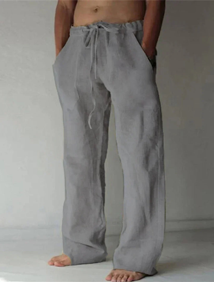 https://cdn.shopify.com/s/files/1/0913/7753/3275/files/Mens-Baggy-Linen-Summer-Trousers-15.webp?v=1773053774