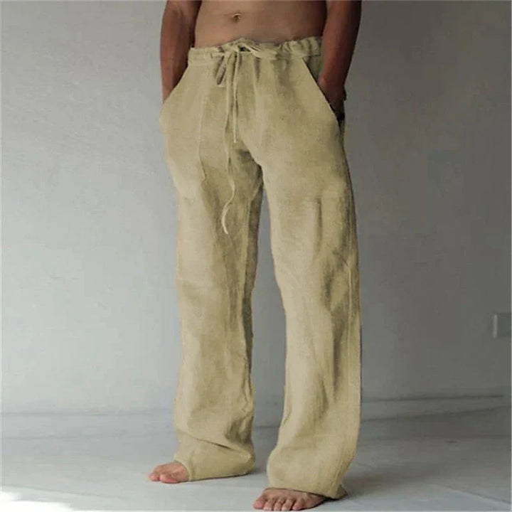 https://cdn.shopify.com/s/files/1/0913/7753/3275/files/Mens-Baggy-Linen-Summer-Trousers-3.webp?v=1773053745