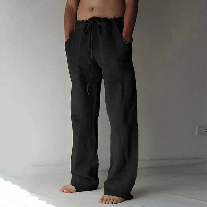 https://cdn.shopify.com/s/files/1/0913/7753/3275/files/Mens-Baggy-Linen-Summer-Trousers-4.webp?v=1773053747