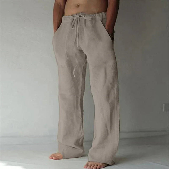 https://cdn.shopify.com/s/files/1/0913/7753/3275/files/Mens-Baggy-Linen-Summer-Trousers-5.webp?v=1773053749