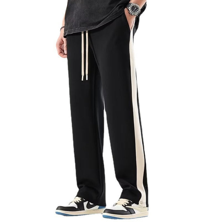 https://cdn.shopify.com/s/files/1/0913/7753/3275/files/Mens-Color-Block-Wide-Trousers-Relaxed-Fit-Casual-Pants-4.jpg?v=1773079621