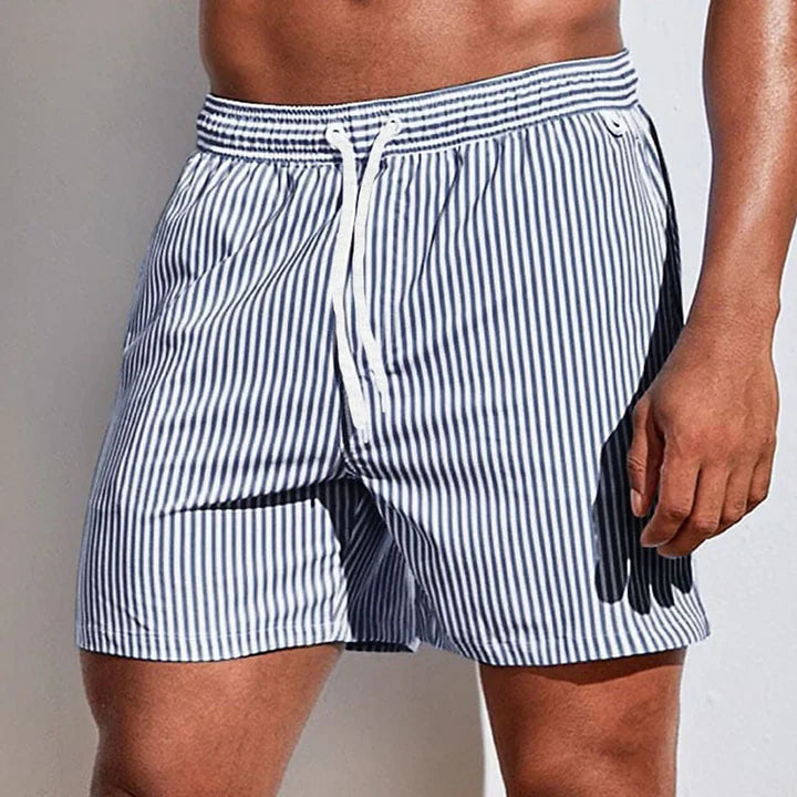 https://cdn.shopify.com/s/files/1/0913/7753/3275/files/Mens-Swim-Shorts-Casual-Quick-Dry-Beachwear-3.jpg?v=1773062400