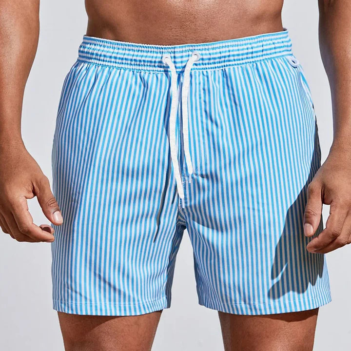 https://cdn.shopify.com/s/files/1/0913/7753/3275/files/Mens-Swim-Shorts-Casual-Quick-Dry-Beachwear-5.jpg?v=1773062406