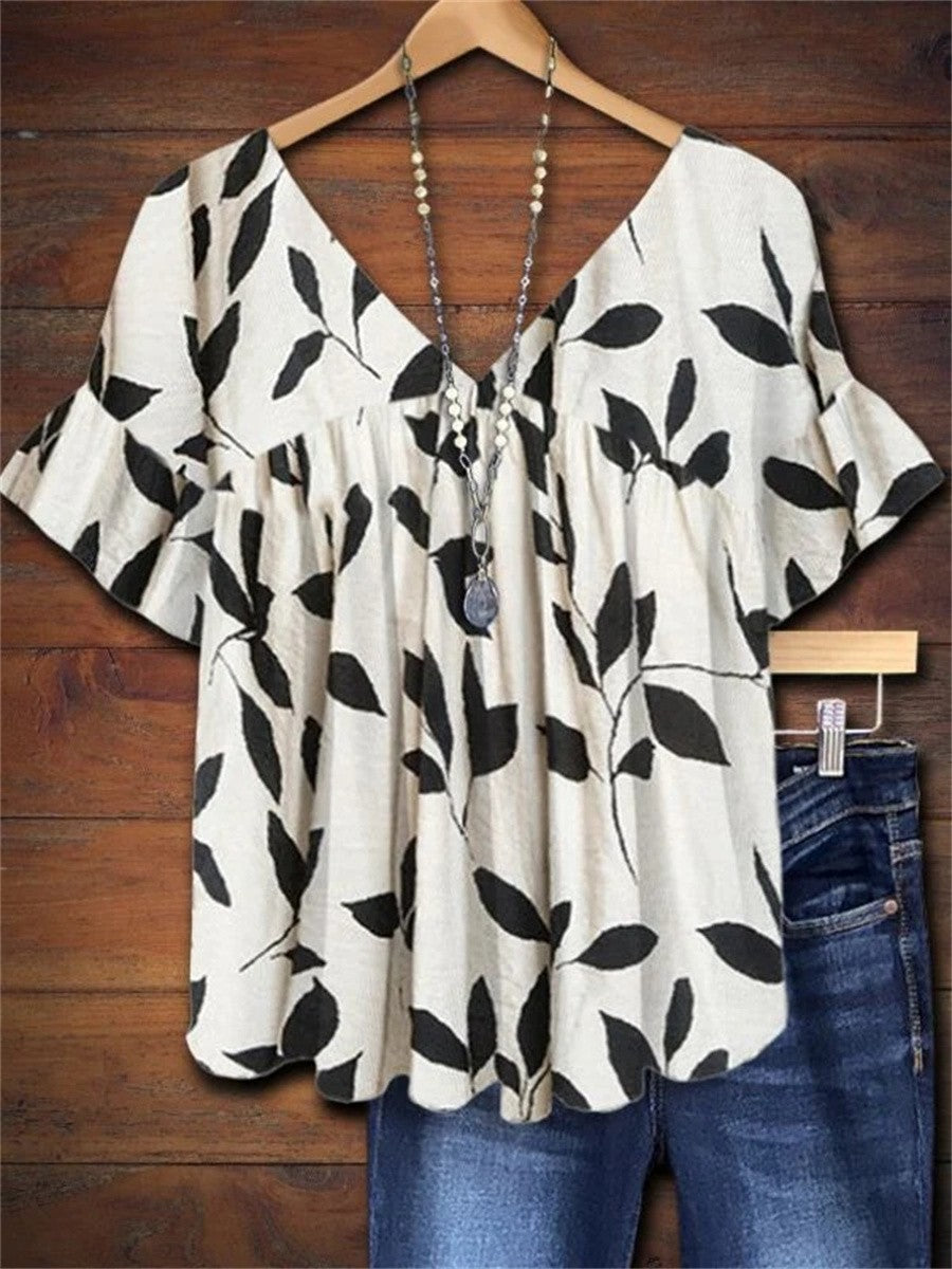 https://cdn.shopify.com/s/files/1/0830/7487/5738/files/Michelle___Rosetta_Botanical_Leaf_Print_Blouse_0.jpg?v=1778598149