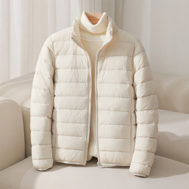 https://cdn.shopify.com/s/files/1/0830/7487/5738/files/SilvaHighCollarDownJacket2.jpg?v=1773741264