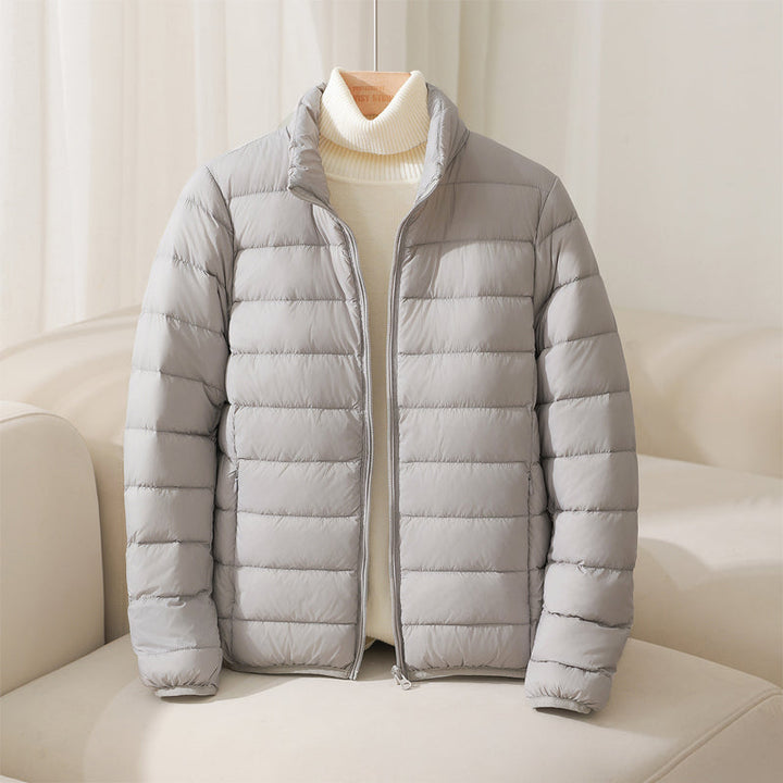 https://cdn.shopify.com/s/files/1/0830/7487/5738/files/SilvaHighCollarDownJacket4.jpg?v=1773741264