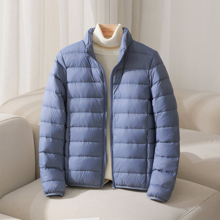 https://cdn.shopify.com/s/files/1/0830/7487/5738/files/SilvaHighCollarDownJacket5.jpg?v=1773741264