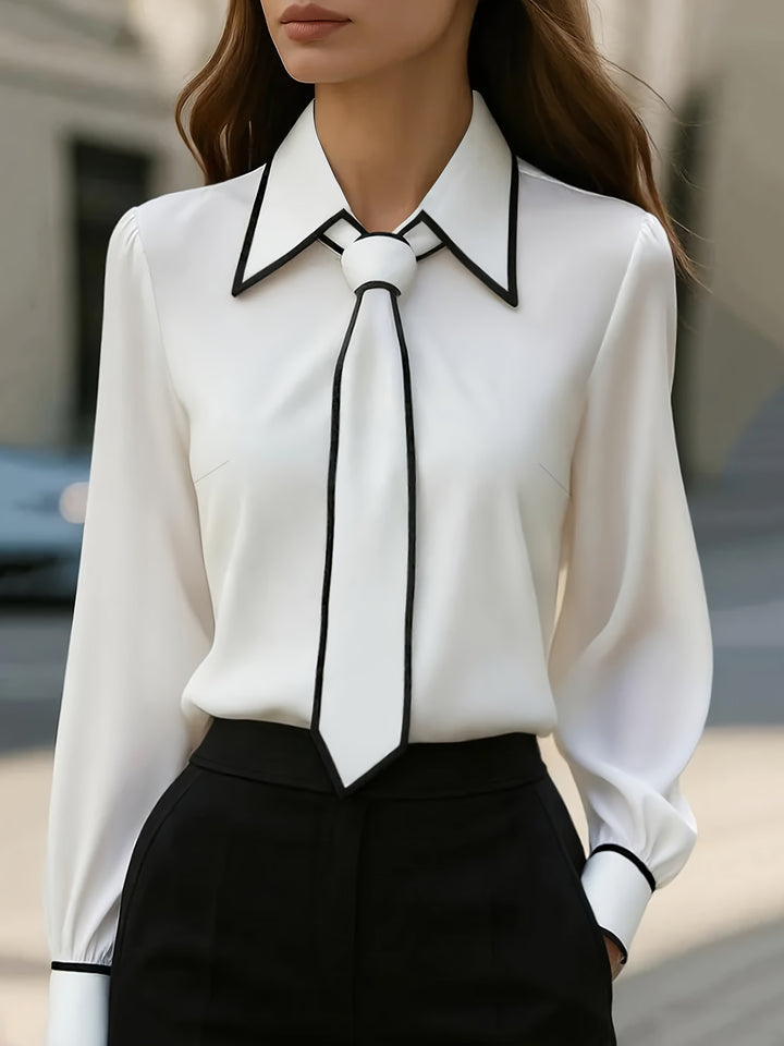https://cdn.shopify.com/s/files/1/0830/7487/5738/files/Susanne___Elegant_Tie_Neck_Contrast_Collar_Blouse_0.jpg?v=1778598157
