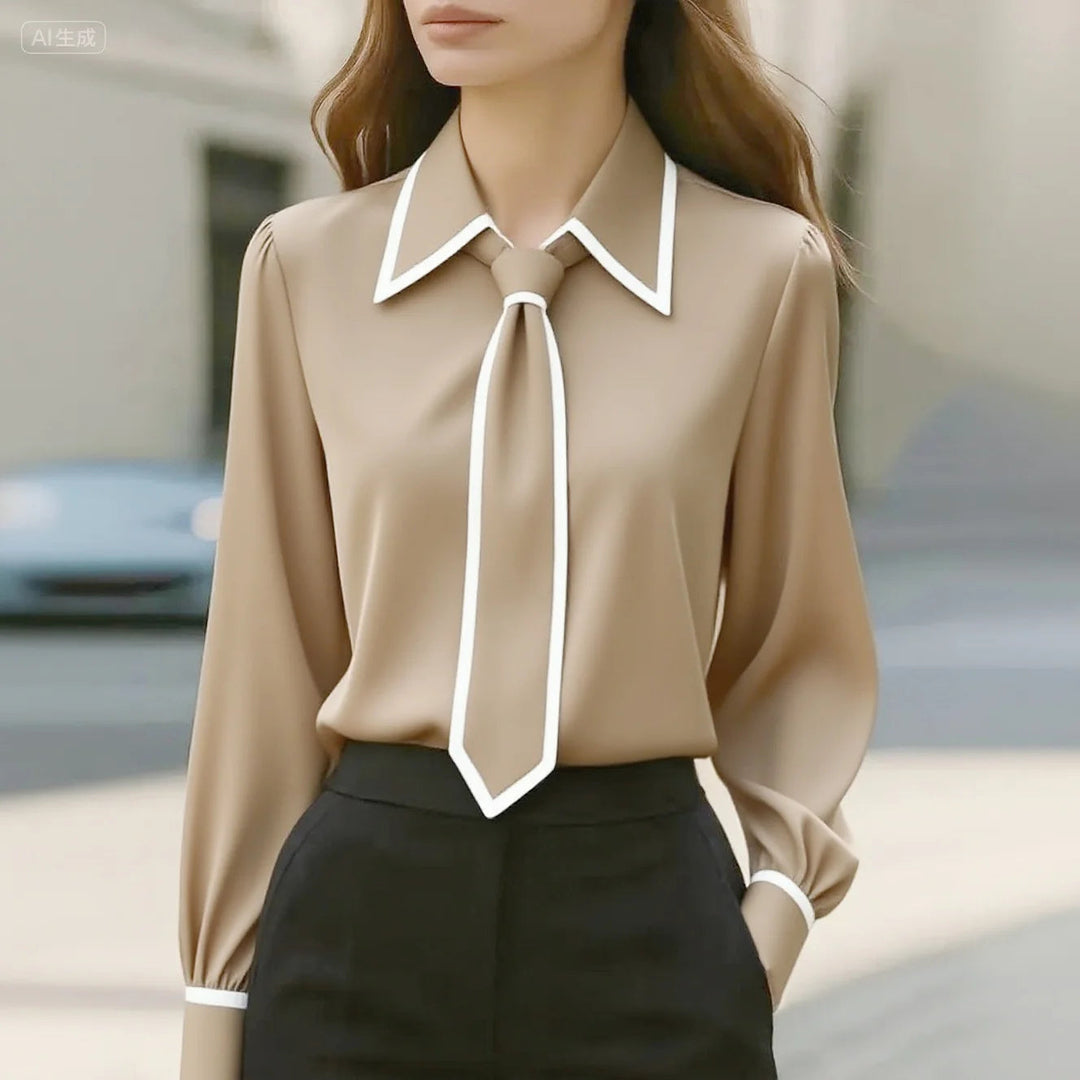 https://cdn.shopify.com/s/files/1/0830/7487/5738/files/Susanne___Elegant_Tie_Neck_Contrast_Collar_Blouse_1.jpg?v=1778598156