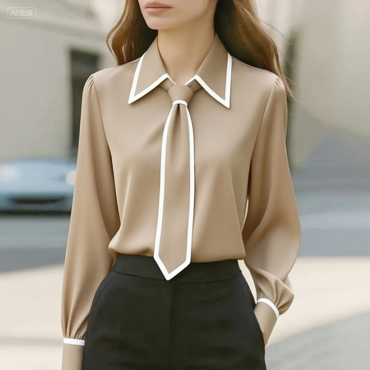 https://cdn.shopify.com/s/files/1/0830/7487/5738/files/Susanne___Elegant_Tie_Neck_Contrast_Collar_Blouse_1.jpg?v=1778598156