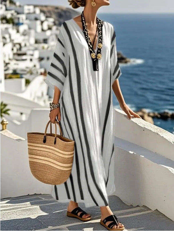 https://cdn.shopify.com/s/files/1/0830/7487/5738/files/Zoe___Long_kaftan_dress__perfect_for_summer_4.jpg?v=1778597061