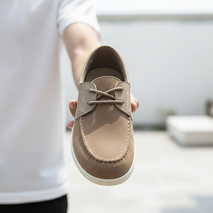 https://cdn.shopify.com/s/files/1/0830/7487/5738/files/freepik__a-lifestyle-photo-of-a-person-holding-a-shoe-direc__36656.png?v=1778082518