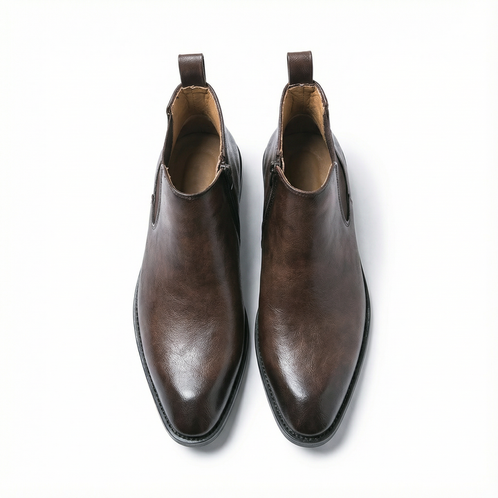 https://cdn.shopify.com/s/files/1/0830/7487/5738/files/freepik__highquality-topdown-studio-photo-of-a-cheslea-boot__29252.png?v=1778082461