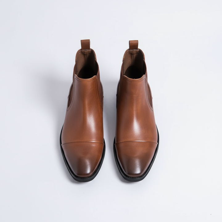 https://cdn.shopify.com/s/files/1/0830/7487/5738/files/freepik__highquality-topdown-studio-photo-of-cheslea-boots-__87694.png?v=1778082468