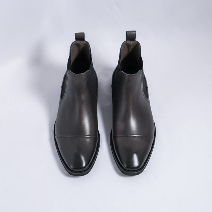https://cdn.shopify.com/s/files/1/0830/7487/5738/files/freepik__highquality-topdown-studio-photo-of-cheslea-boots-__87695.png?v=1778082467